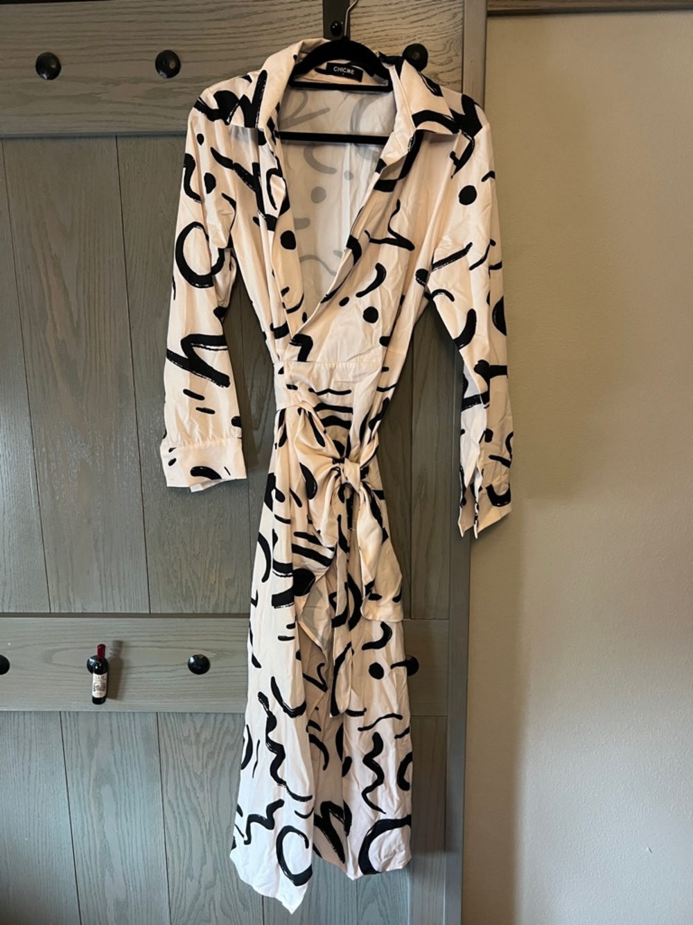 chic Black and Cream Abstract Midi Wrap Dress